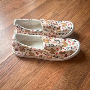 Size 8 slip on sneakers with dog print from the Humane Society.